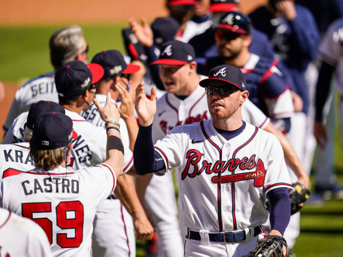 Braves celebrate after beating Reds